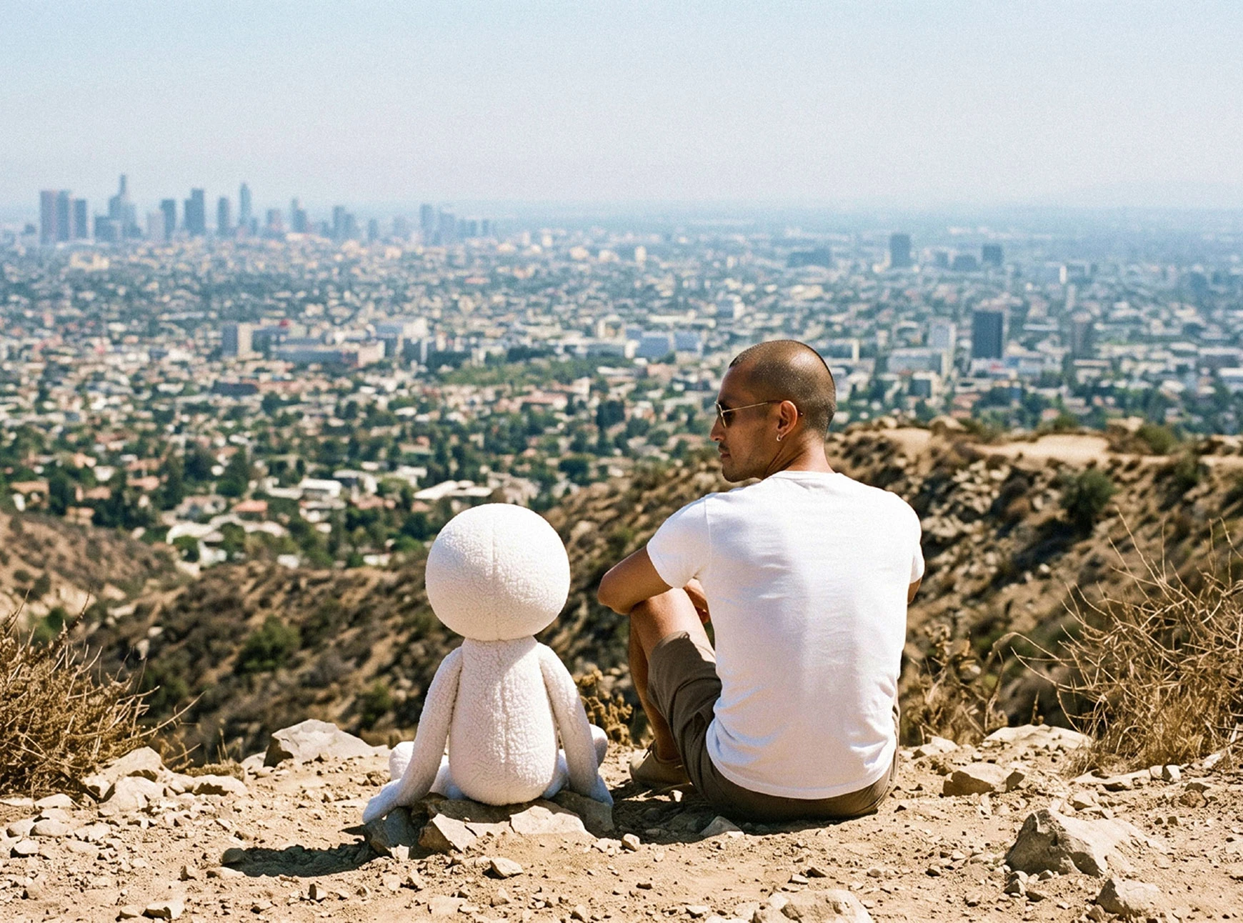 George and CVS sitting on a hillside overlooking Los Angeles