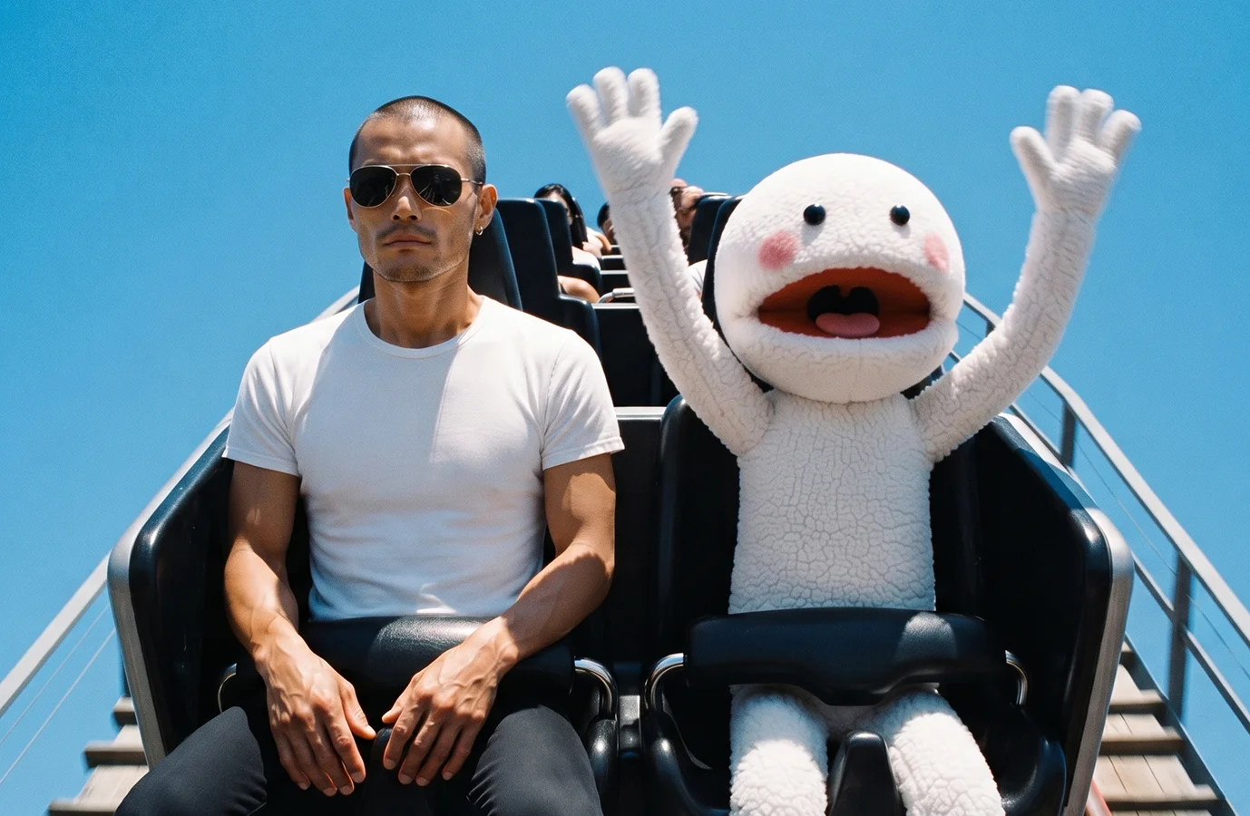 George and CVS on a roller coaster, CVS with arms raised